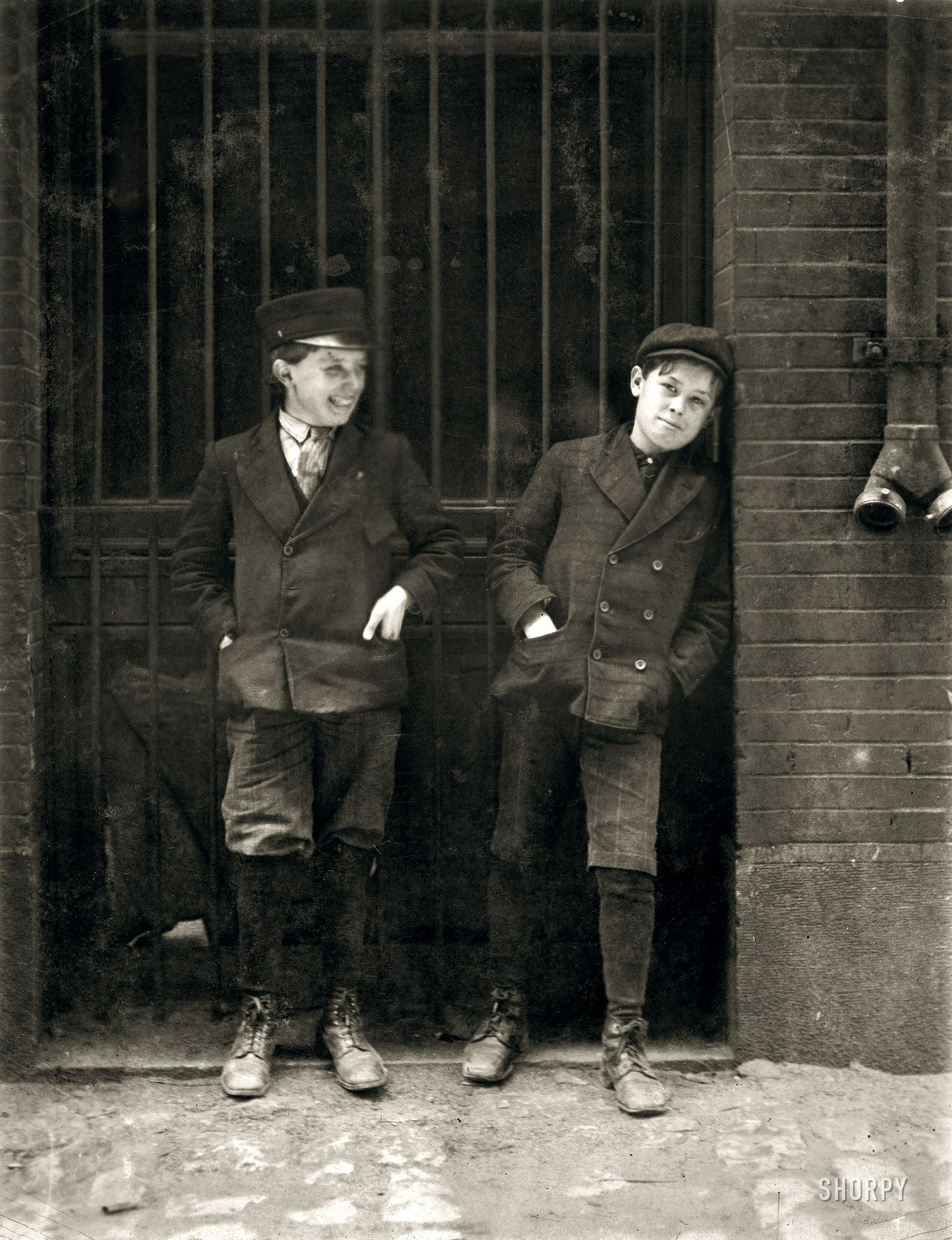 May 1910. St. Louis, Mo. "Two boys working in Inland Type Foundry, 12th & Locust. Work 9 to 10 hours a day. Noon." Photo by Lewis Hine. View full size.