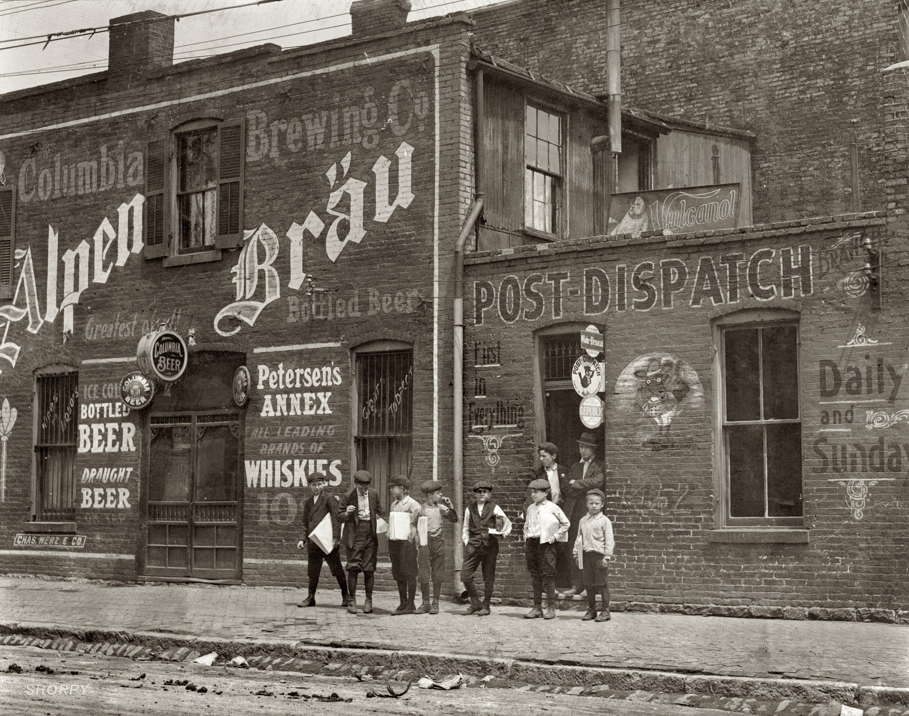St. Louis, Missouri. May 1910. "Newsies. Johnston's Branch adjoining Saloon at 10th & Cass Street." Photograph by Lewis Wickes Hine. View full size.