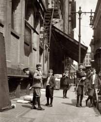 May 1910. St. Louis, Missouri. "Bundle Boys at Nugent's, Washington and Broadway." Photograph and caption by Lewis Wickes Hine. View full size.