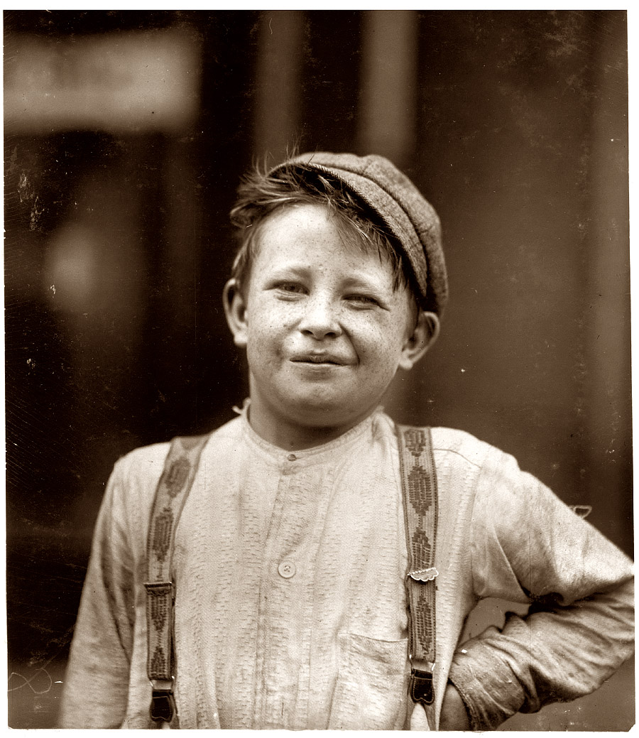 Donald "Happy" Mallick, 9 years of age, has been selling newspapers 5 years. His father, a rivet driver, earns $20 weekly. Boy very imaginative, and when last seen had a rusty 5 inch knife which he said he found and was playing with the same in gutter. View full size. Photo by Lewis W. Hine, May 1910.
