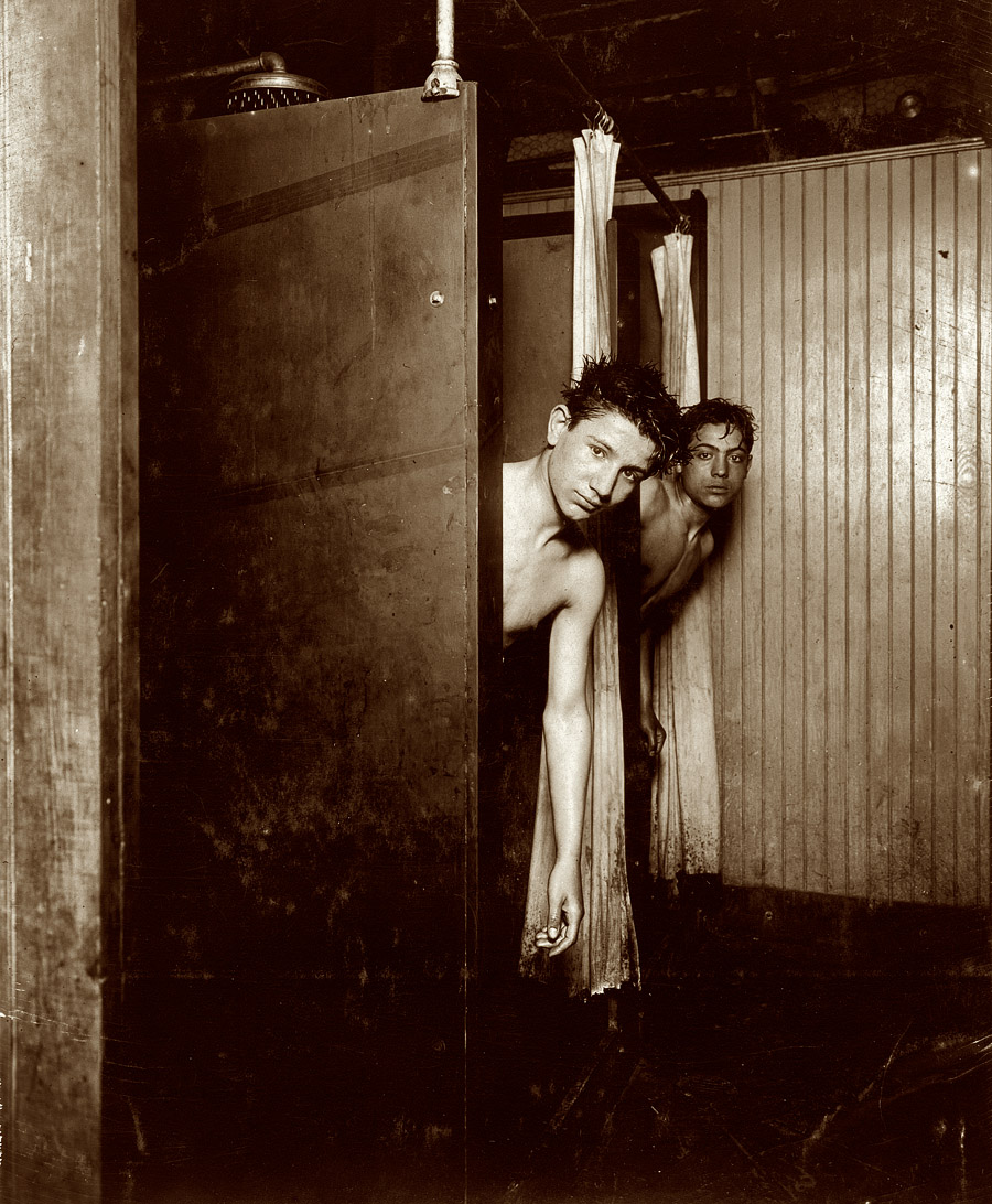 July 1910. Postal Telegraph Co. messengers, 283 Broadway. "The boys make good use of the shower baths." View full size. Photograph by Lewis Wickes Hine.