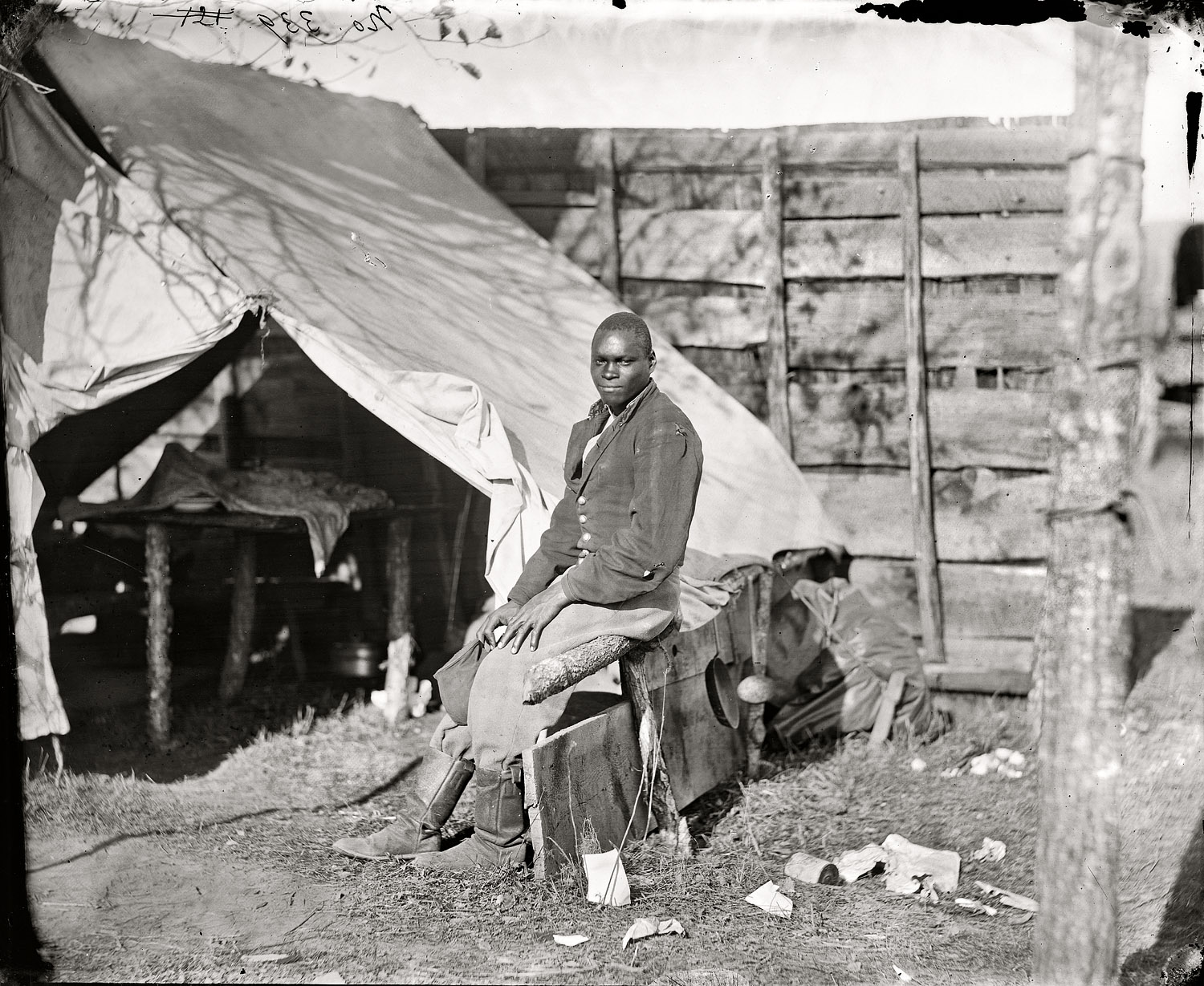 October 1863. Bealeton, Virginia. "John Henry, servant, at headquarters, 3d Army Corps, Army of the Potomac." Wet-plate glass negative. View full size.