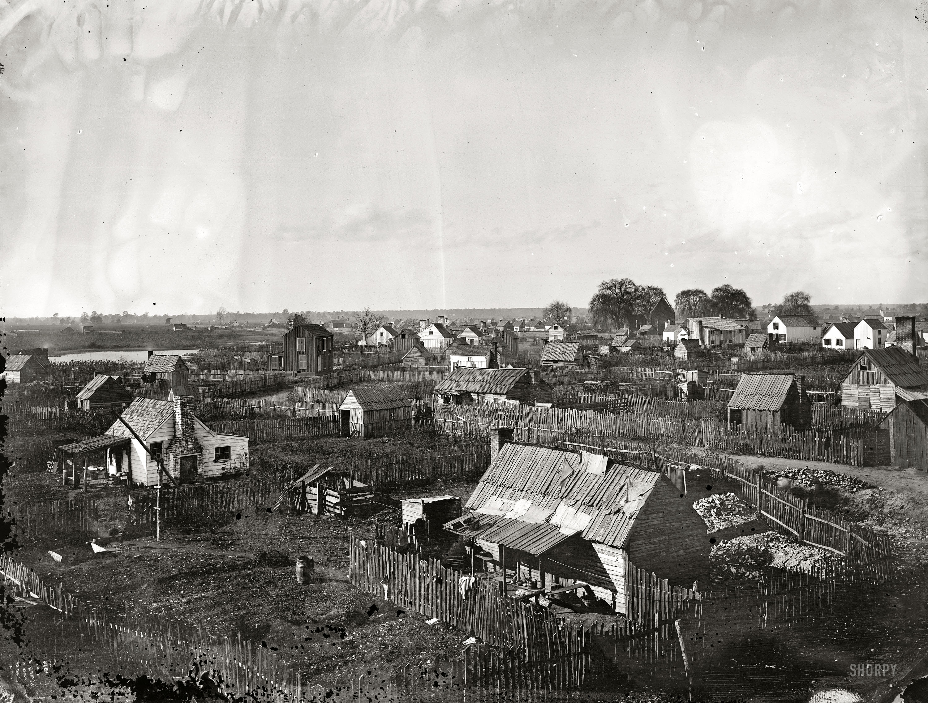 December 1864. "Hampton, Virginia. View of the town. From photographs of the Federal Navy and seaborne expeditions against the Atlantic Coast of the Confederacy." Wet-plate glass negative, photographer unknown. View full size.