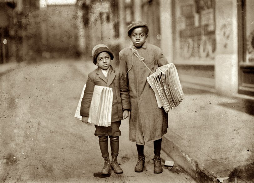Newark, New Jersey. December 1912. "Eldridge Bernard, 11 years old. Buster Smith, 6 years old. Colored route boys of Newark. Taken at 4 p.m." Photograph and caption by Lewis Wickes Hine. Library of Congress. View full size.
