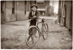 Waco, Texas. September 1913. "Messenger boy working for Mackay Telegraph Company. Said fifteen years old. Exposed to Red Light dangers." View full size. Photograph by Lewis Wickes Hine.
15?No way he is 15, I bet he is 12 
15?I would guess 12 or 13.  Kids had to grow up quickly back then.
Pipe?He's about 14 and he's smoking a pipe. He's been around the block.
Re: Pipe?Heh. That's nothing compared to some of the other Hine kids.
(The Gallery, Kids, Lewis Hine)