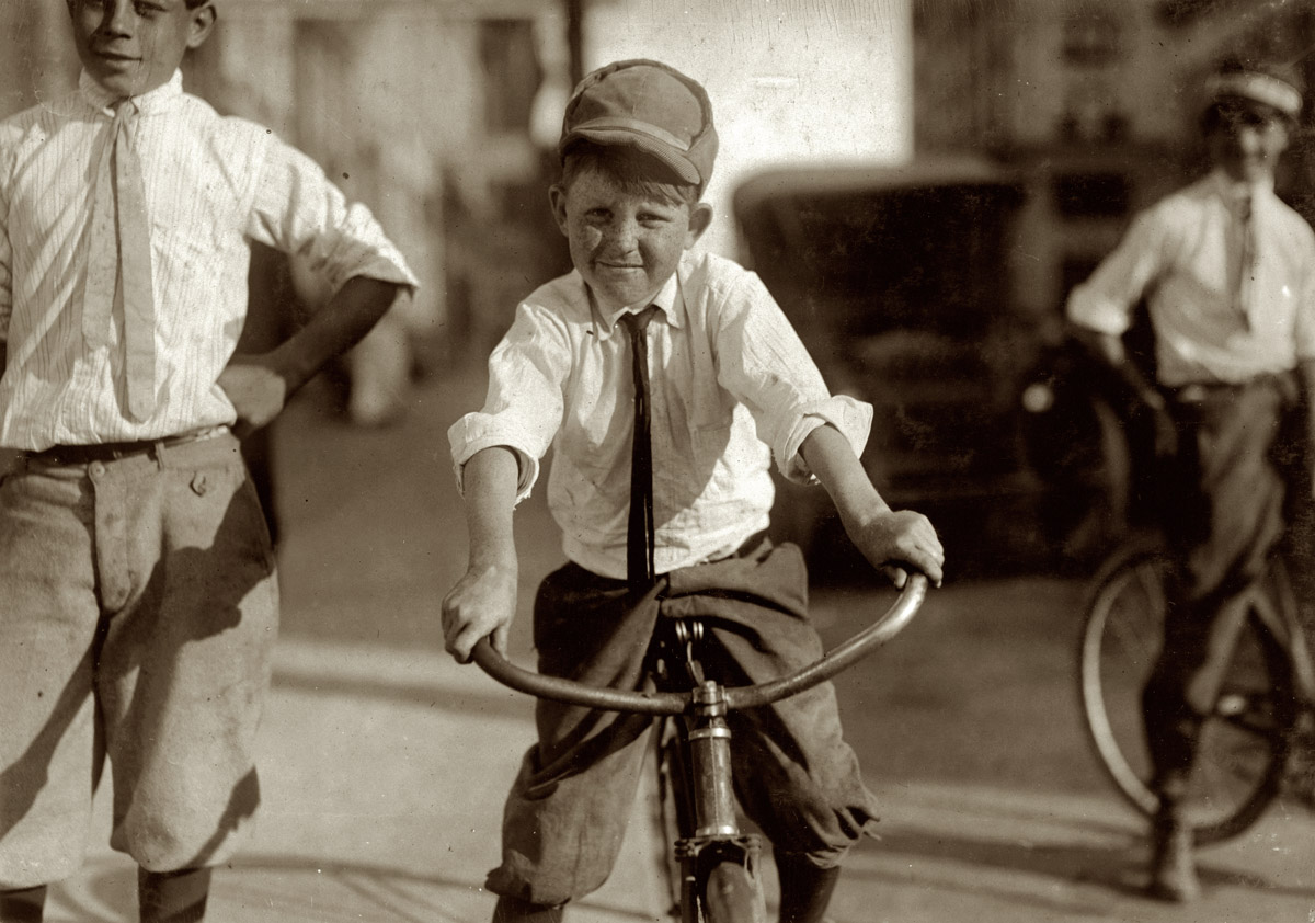 Houston, October 1913. "Eleven-year-old Western Union messenger #51. J.T. Marshall. Been day boy here for five months. Goes to Red Light district some and knows some of the girls." View full size. Photograph by Lewis Wickes Hine.