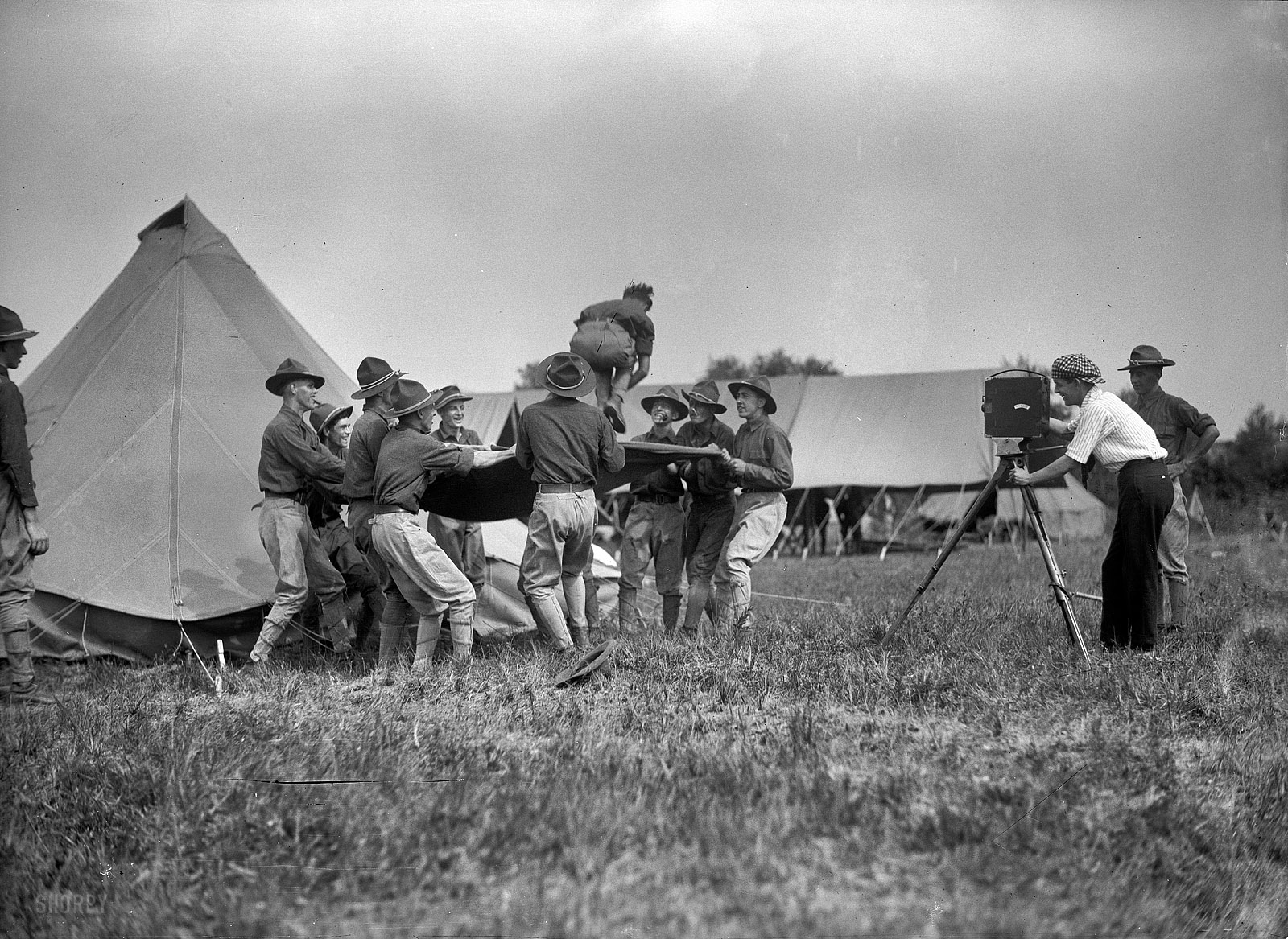 1915. "National Guard of D.C. -- Field tactics." Nothing like a blanket toss to confuse the enemy. Note the Hollywood type behind the movie camera. Harris & Ewing Collection glass negative, Library of Congress. View full size.