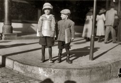 October 1913. Dallas, Texas. "Two six-year-old newsboys. Odell McDuffy and Sam Stillman. There are many other of six and seven years selling here." Photograph and caption by Lewis Wickes Hine. View full size.