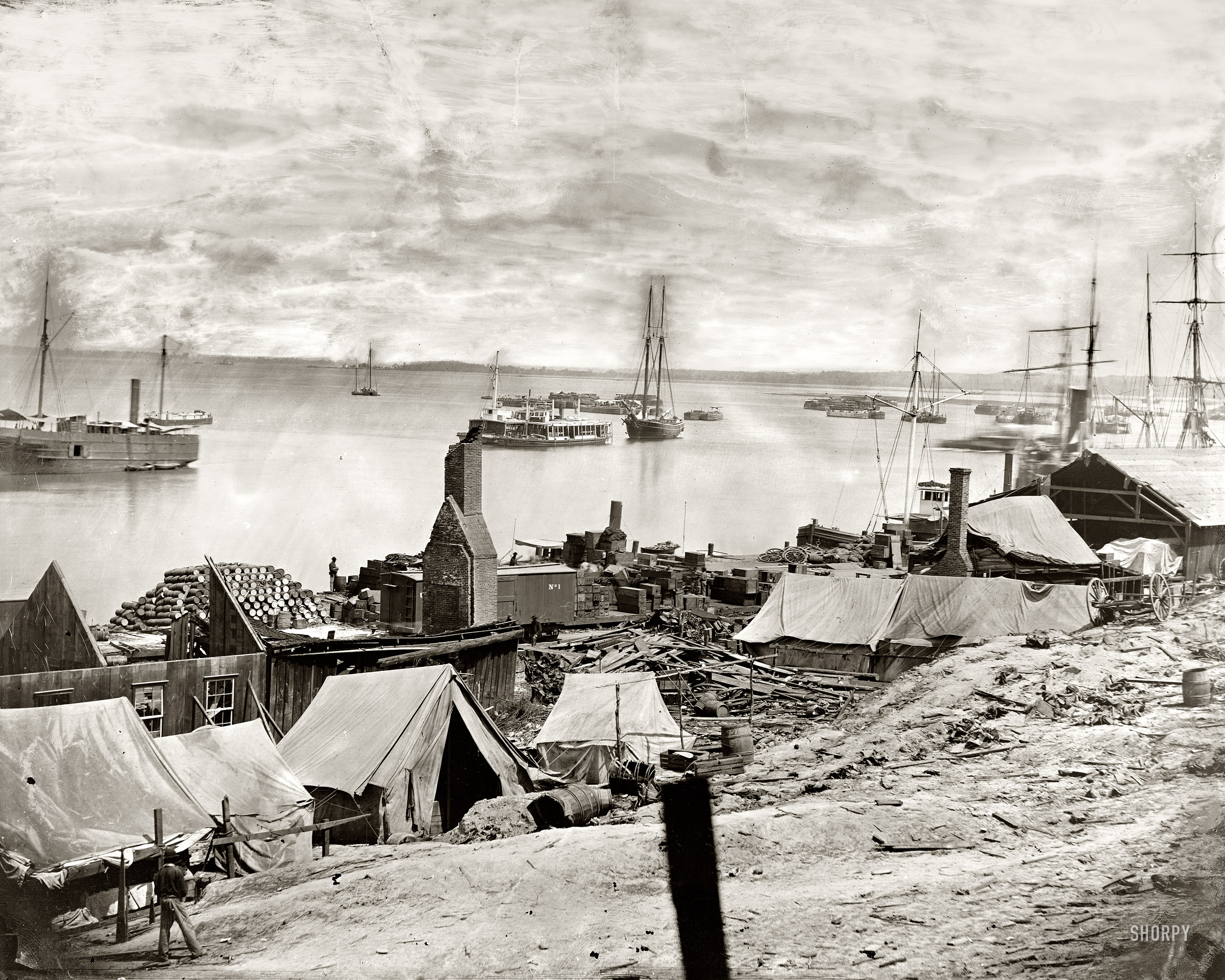 City Point, Virginia. "Wharves after the explosion of ordnance barges on August 4, 1864." Wet-plate glass negative from photographs of the main Eastern theater of war, the siege of Petersburg, June 1864-April 1865. View full size.