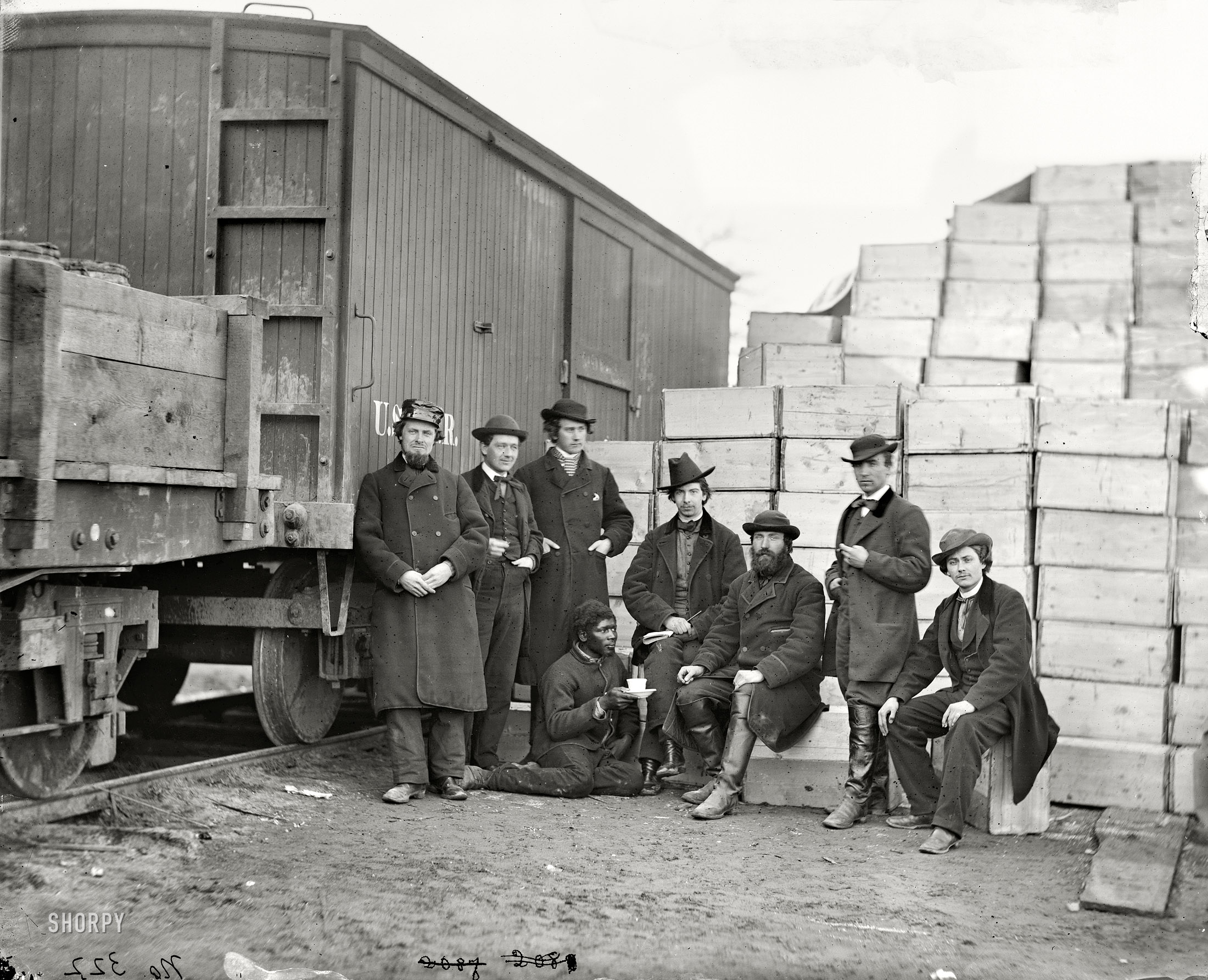 Aquia Creek Landing, Virginia, circa 1863. "Federal Army. Clerks of the Commissary Depot by railroad car and packing cases." A somewhat unsettling scene. Wet plate glass negative by Alexander Gardner. View full size.