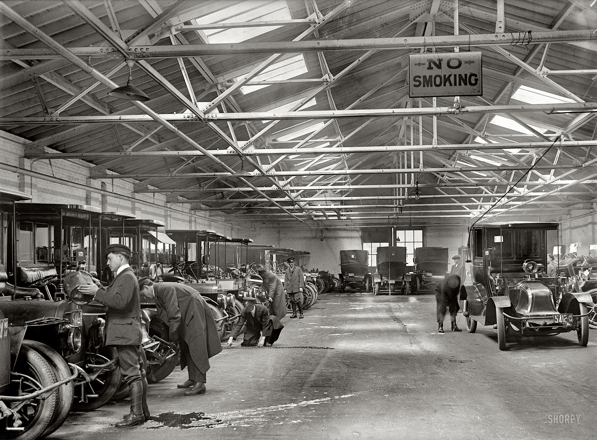 Washington, D.C., 1914. "Federal taxicab garage, 13th Street." These cabs served Union Station. Harris & Ewing Collection glass negative. View full size.