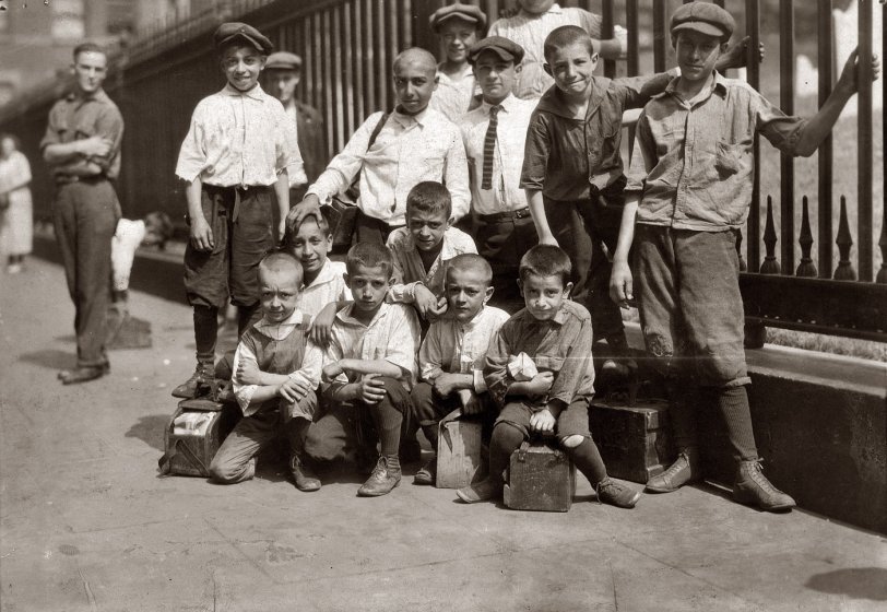 July 25, 1924. "Some of the young bootblacks working around Trinity Church, New York City." View full size. Photo and caption by Lewis Wickes Hine.