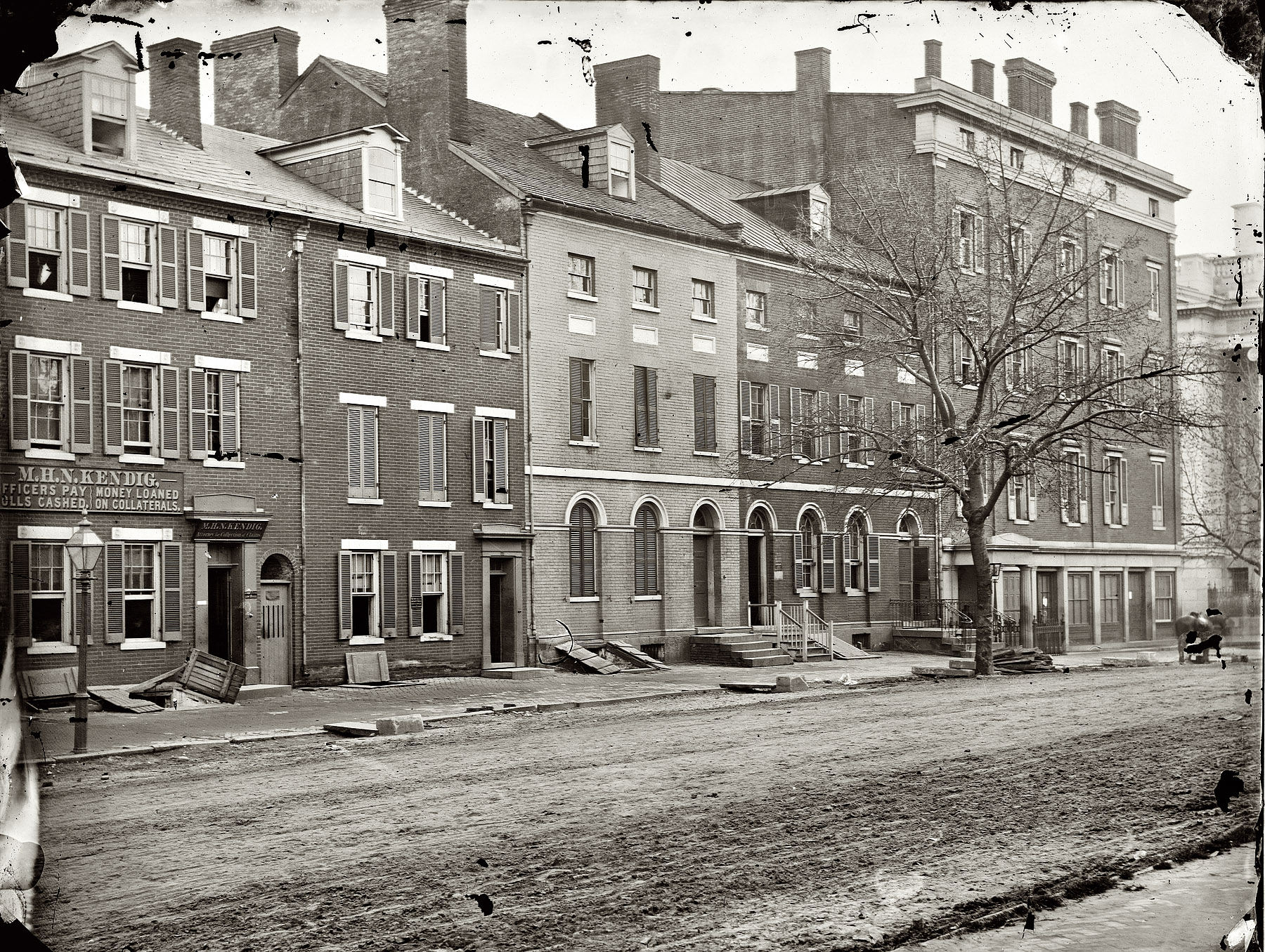 April 1865. "Washington, District of Columbia. Sanitary Commission storehouse and adjoining houses at 15th and F Streets N.W." Wet plate glass negative, photographer unknown. View full size.