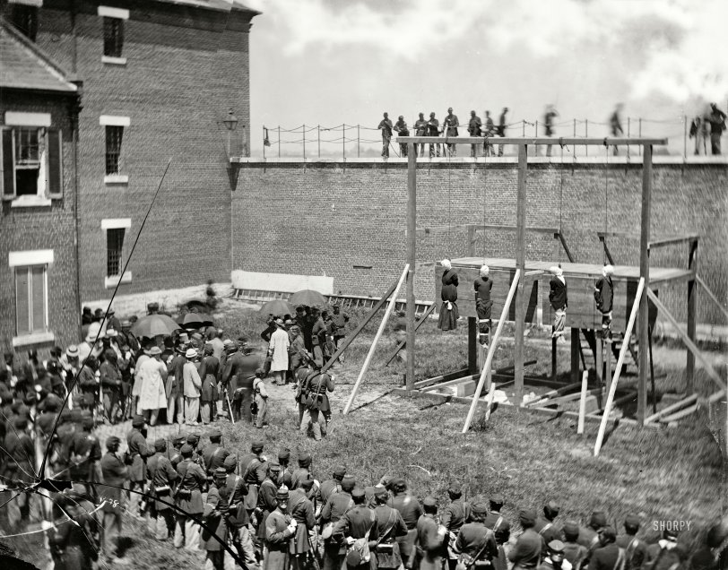 July 7, 1865. "Washington, D.C. Hanging hooded bodies of the four conspirators; crowd departing." Lincoln assassination conspirators Mary Surratt, Lewis Payne, David Herold and George Atzerodt shortly after their execution at Fort McNair. Wet plate glass negative by Alexander Gardner. View full size.
