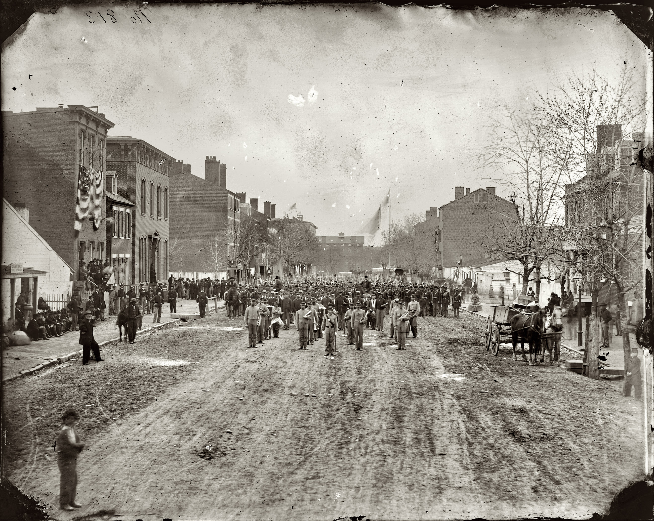 March 1865. "Washington, District of Columbia. 1st U.S. Volunteer Infantry. Hancock's Veteran Corps on F Street N.W." Wet plate negative, photographer un- known. Library of Congress Civil War glass negative collection. View full size.
