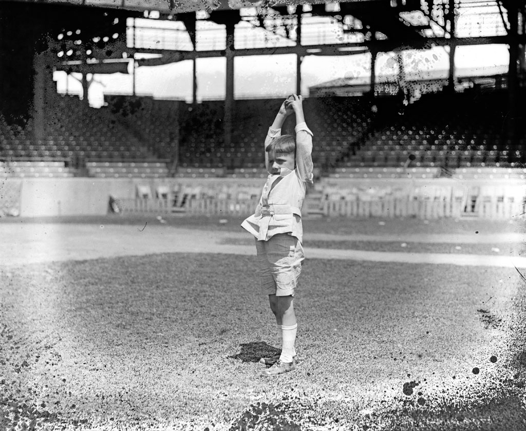 A child playing baseball. From the National Photo Company collection, 1921. View full size.