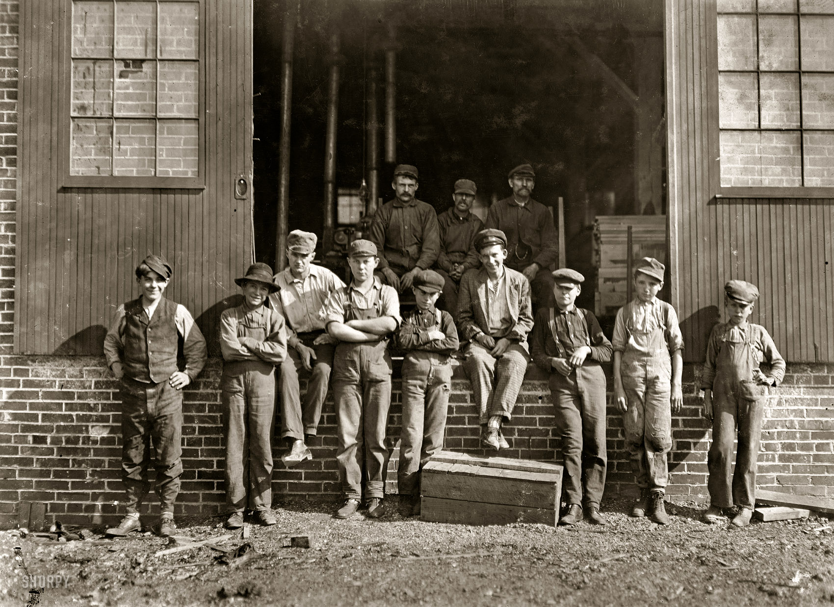 October 1908. Evansville, Indiana. "World Furniture Company, noon hour. Boy at left hand end was running machine composed of two unguarded circular Saws. The board he was pushing stuck and he gave it an impatient shove. Had he slipped, both hands and arms would have gone into the edges of the saws." Photograph and caption by Lewis Wickes Hine. View full size.