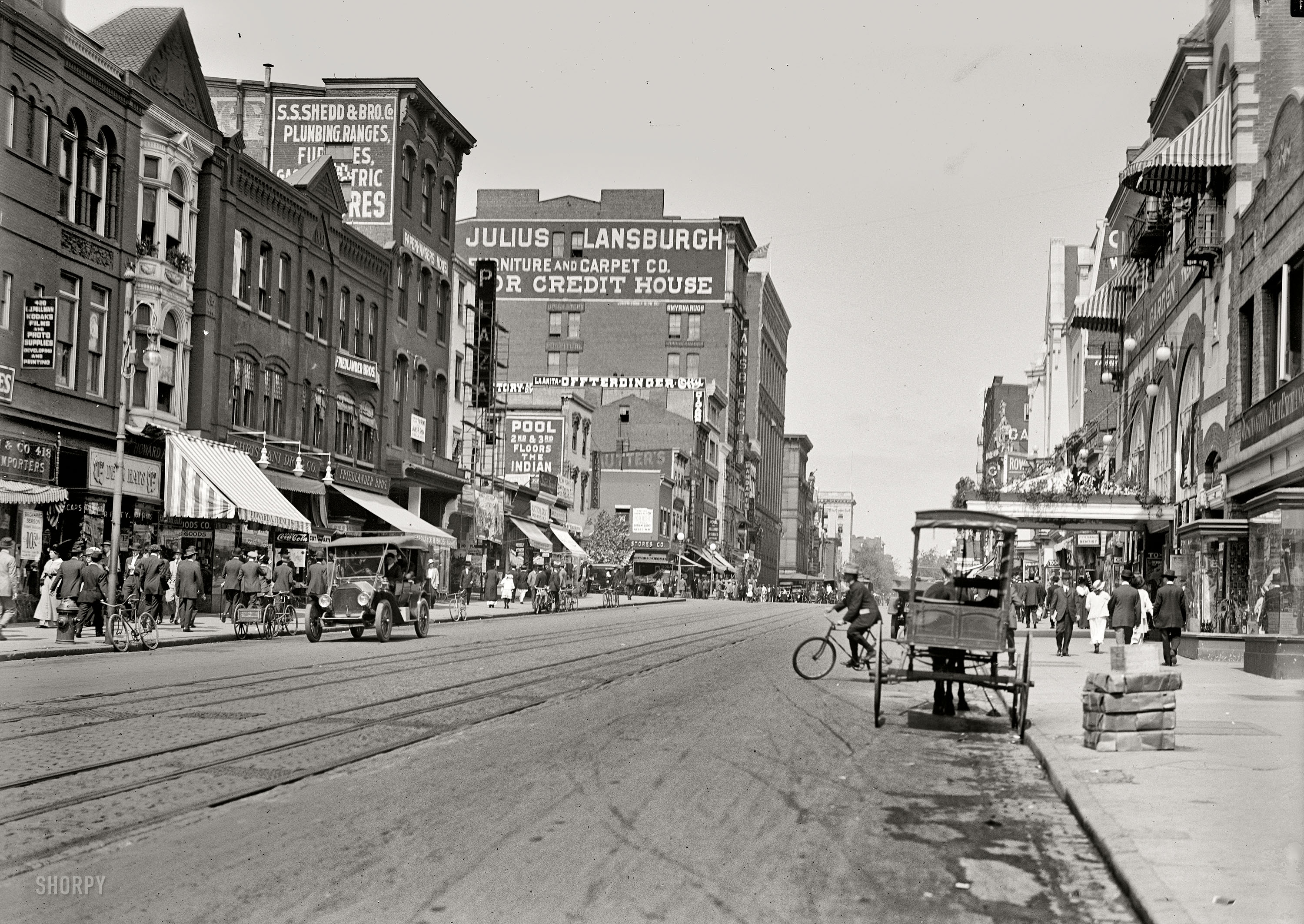 Washington, D.C., 1915. "Street scene, Ninth Street N.W." Among the merchants represented here is department-store magnate Julius Lansburgh. View full size.