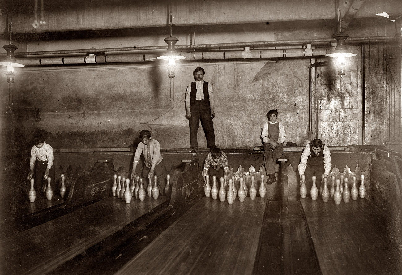April 1910. "1 a.m. Pin boys working in Subway Bowling Alleys, 65 South Street, Brooklyn, N.Y., every night. Three smaller boys were kept out of the photo by Boss." View full size. Photograph and caption by Lewis Wickes Hine.