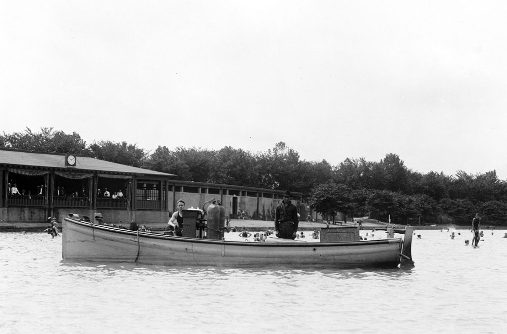 Workers on a Chloro boat, which was used for disinfecting large outdoor swimming areas. This photo was likely taken in the Washington, D.C., area. Photo from the National Photo Company collection, 1921. View full size.
