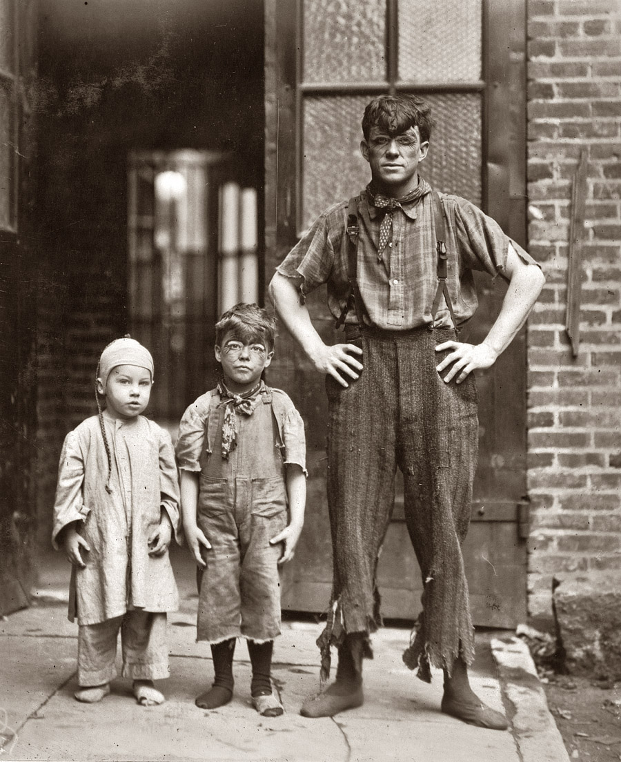 This picture shows the "Four Novelty Grahams" acrobatic performers at the Victoria Theatre, Philadelphia. The father is 23 years of age. Willie Graham is 5 years of age, and Herbert Graham is 3 years of age. At 9 P.M. on June 10th, 1910, these children were performing on the stage. Four times daily they do a turn which lasts from 12 to 14 minutes. Herbert Graham, the youngest, was said by the father to have commenced performing on the stage as an acrobat when he was 10 months of age. Willie, now 5, is said to be the youngest acrobat in the world. The mother of these boys was formerly a school teacher, and is now performing with this trio on the stage. The children are bright and strong, but have a playfulness about them which shows them to have forgotten the best years of childhood. Photo by Lewis W. Hine, 1910. View full size.