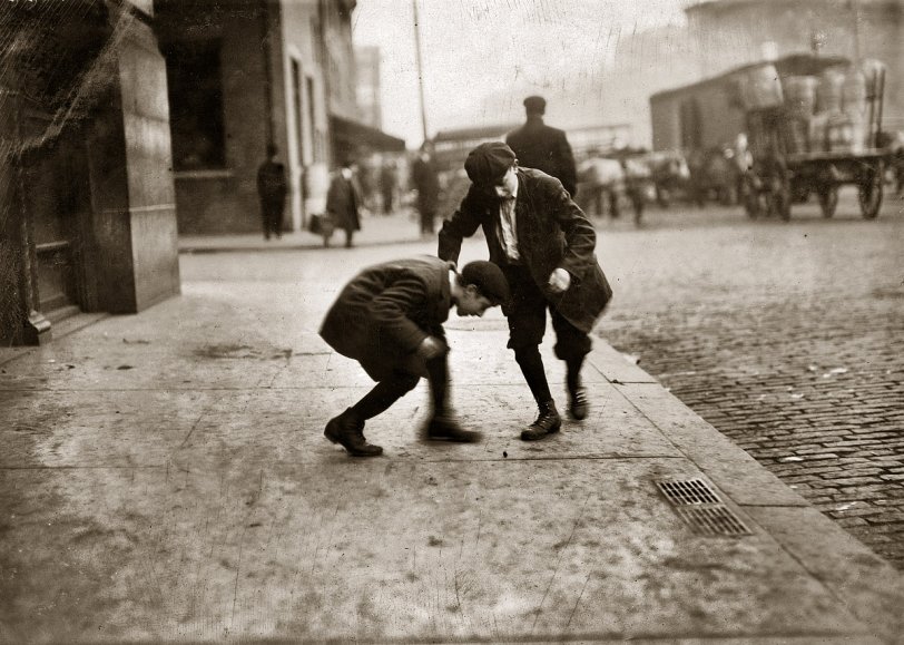 November 1912. "Pitching Pennies. Providence, Rhode Island. For Child Welfare Exhibit." Photograph by Lewis Wickes Hine. View full size.
