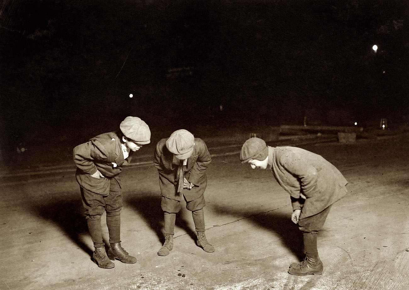 November 23, 1912. Providence, Rhode Island. "A midnight crap game in the street near the Post Office. One 12 years old, one 14. One had been shooting here a couple of hours." View full size. Photo and caption by Lewis Wickes Hine.