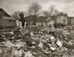 November 1912. "Children going through Whitman Street dump. Pawtucket, Rhode Island." Photograph by Lewis Wickes Hine. View full size.