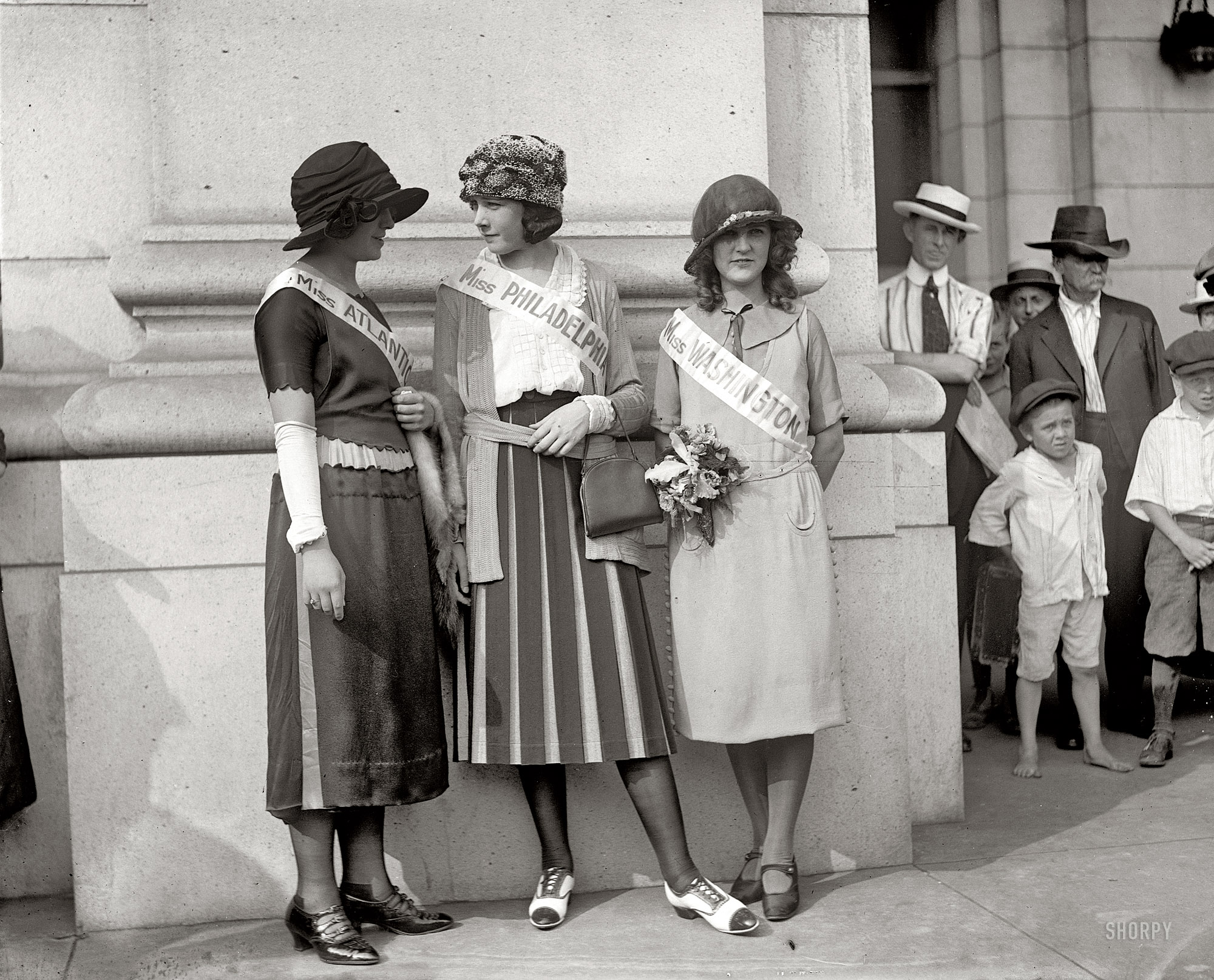 1921. Inter-City Beauties Ethel Charles, Nellie Orr and Margaret Gorman at Union Station in Washington, D.C. Margaret would be crowned winner at the very first Miss America pageant. National Photo Company glass negative. View full size.