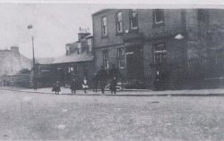 This is the only photograph my family has of Nitshill Scotland; the birthplace of my great-grandfather. The Taylor family lived above the Pub. This would have been around 1900.
Nitshill   Interested to see this old photograph, passed through Nitshill about three weeks ago, Much different from then, When there would have been coal mining &amp; lime works locally  Nowadays an urban sprawl being re developed  Again! no industry or old pub left, up until about the mid 1960/s the lime works shunting locomotive used to take its wagons across the road
(ShorpyBlog, Member Gallery)