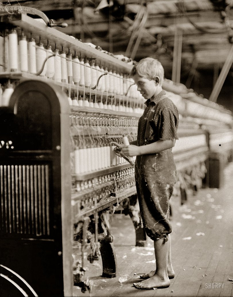 September 1910. North Pownal, Vermont. "Clarence Wool, 11 years. Spinner in North Pownal Cotton Mill. Worked only during vacation." Photograph (original glass negative) and caption by Lewis Wickes Hine. View full size.
