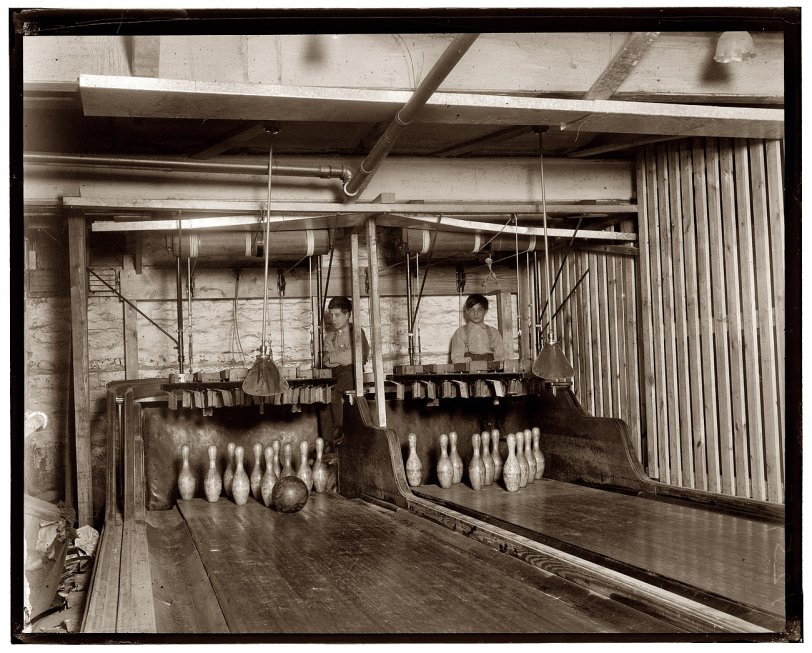 February 1910. "Bowling Alleys connected with Geo. P. Gray's Bastable Cafe on Genesee Street. About eight very small boys employed here. Work until midnight. Photo taken at 11:30 p.m." View full size. Photo &amp; caption: Lewis Wickes Hine.

