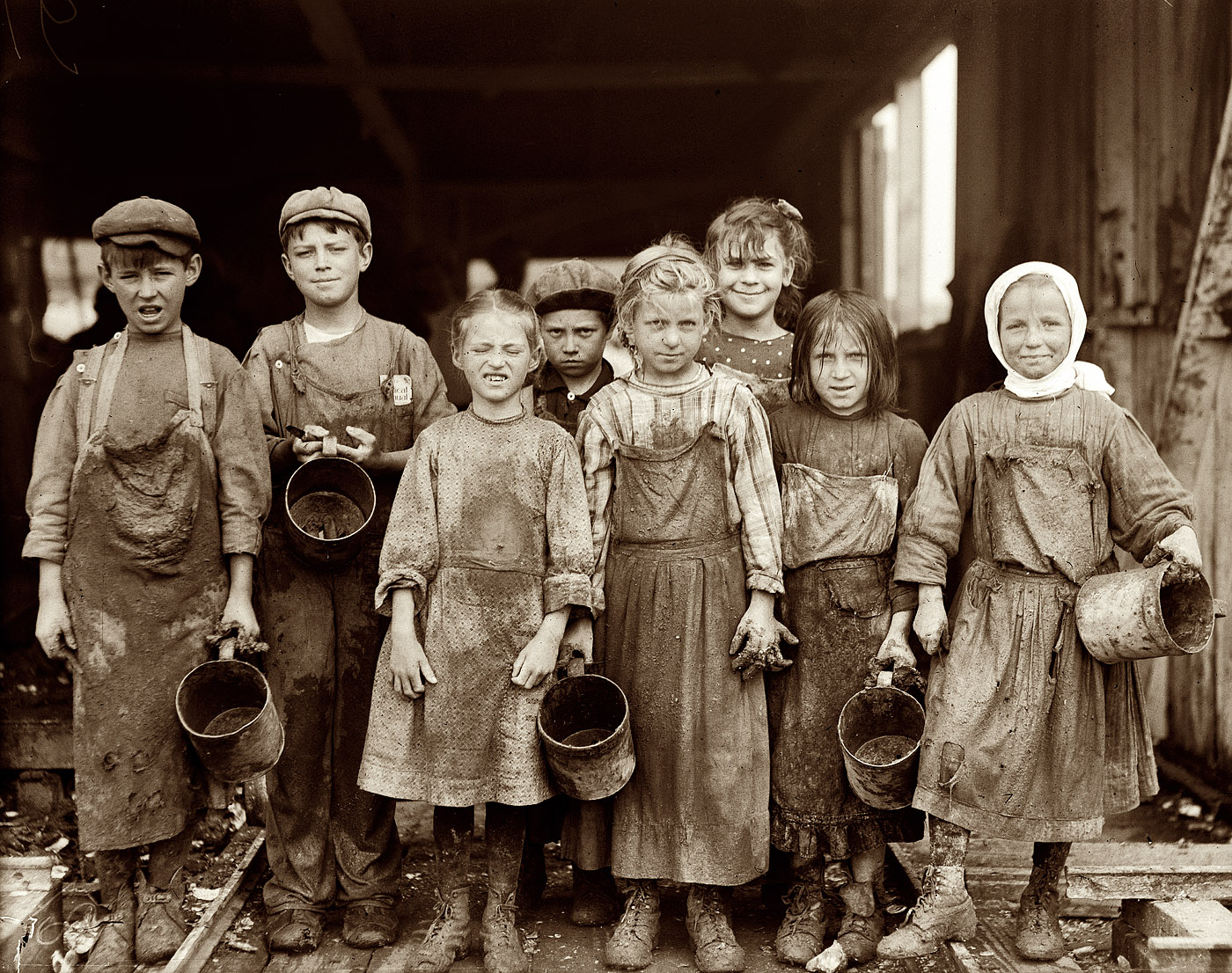 February 1912. Port Royal, South Carolina. "Nine [?] of these children from 8 yrs. old up go to school half a day, and shuck oysters for four hours before school and three hours after on school days, and on Saturday from 4 a.m. to early afternoon. Maggioni Canning Co." View full size. Photo and caption by Lewis Wickes Hine.