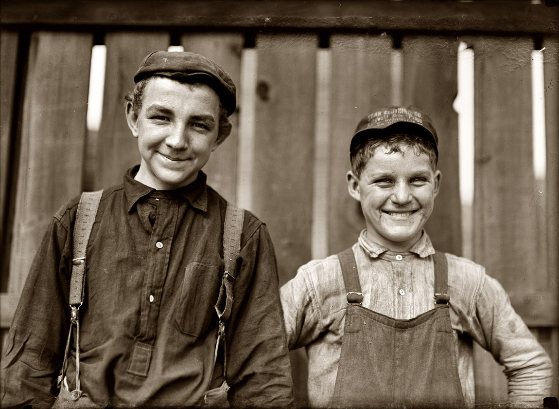 October 1908. South Bend, Indiana. "Going home to lunch! Two boys from Singer Manufacturing Company. Small boy is Charles Bailey, 316 Scholum Street. Is he 14 years old?" View full size. Photograph and caption by Lewis Wickes Hine.