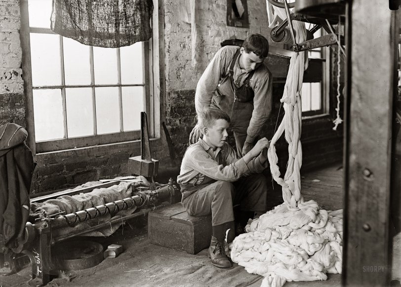 December 1908. Newton, North Carolina. "Boy at warping machine. Been there two years. Clyde Cotton Mill." Photograph by Lewis Wickes Hine. View full size.
