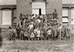 January 1909. Tifton, Georgia. "Workers in the Tifton Cotton Mills. All these children were working or helping, 125 in all. Some of the smallest have been there one year or more." Photo and caption by Lewis Wickes Hine. View full size.