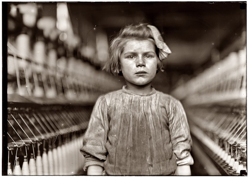 January 1909. "A little spinner in Globe Cotton Mill. Augusta, Ga. The overseer admitted she was regularly employed." View full size. Lewis Wickes Hine.