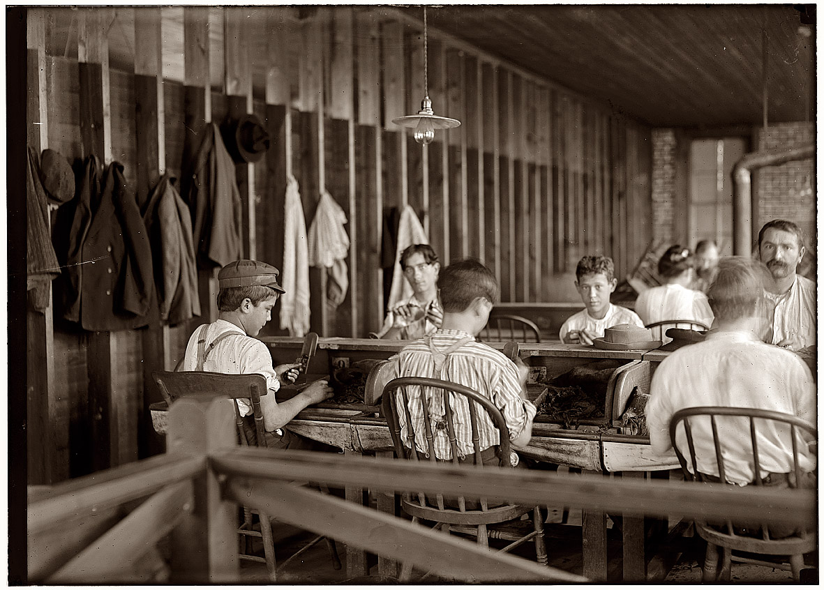 Tampa, Florida. Cigarmakers in the factory of Filogamo & Alvarez, January 1909. View full size. Photograph by Lewis Wickes Hine. This part of Tampa is the now fashionably upscale Ybor City district, where many of the old cigar factories have been repurposed as apartments, condos and gallery spaces. Starbucks, anyone?