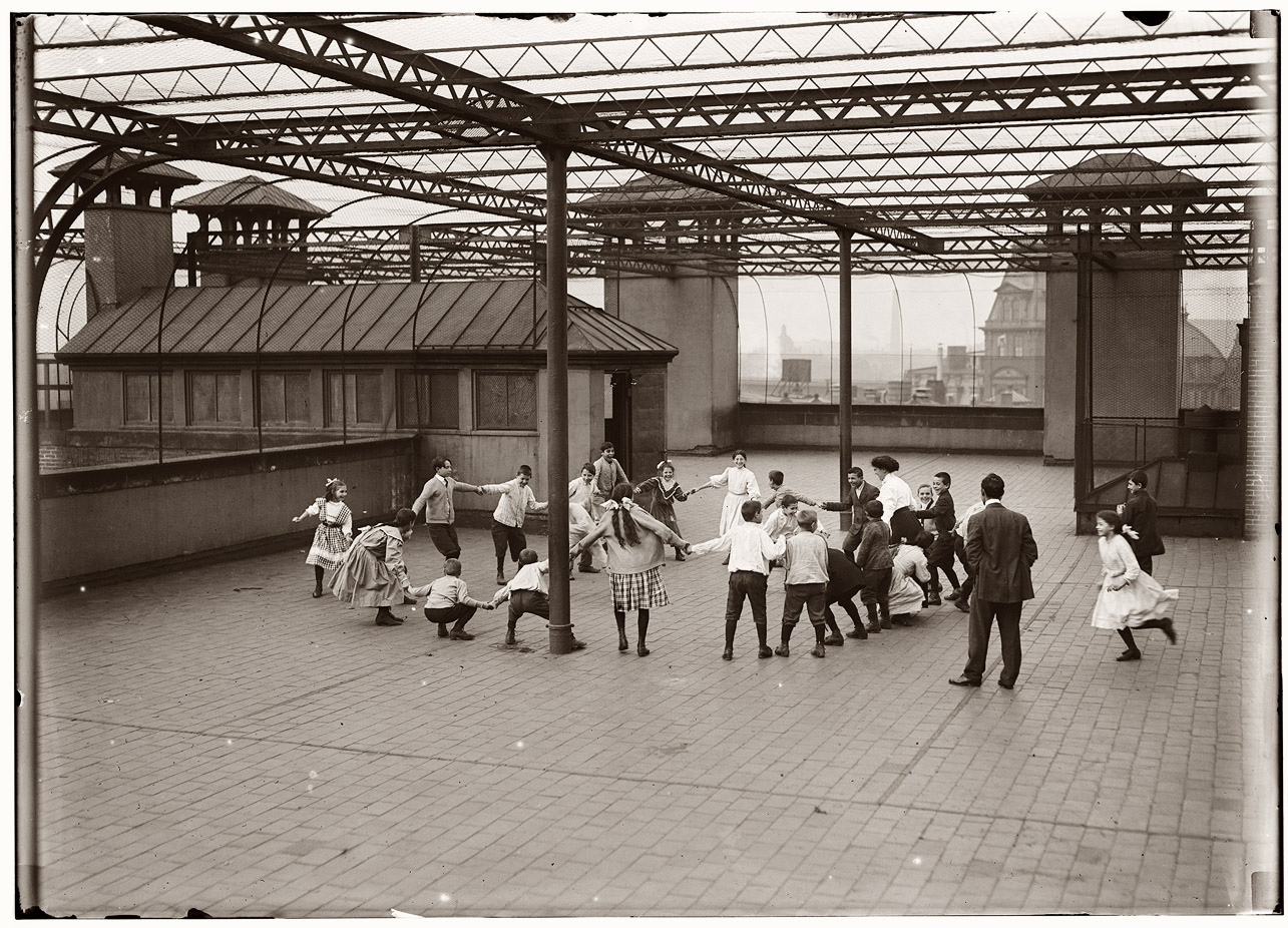 "Immigrant children learning to play on the roof garden of the Washington School in Boston." October 1909. View full size. Photograph by Lewis Wickes Hine.