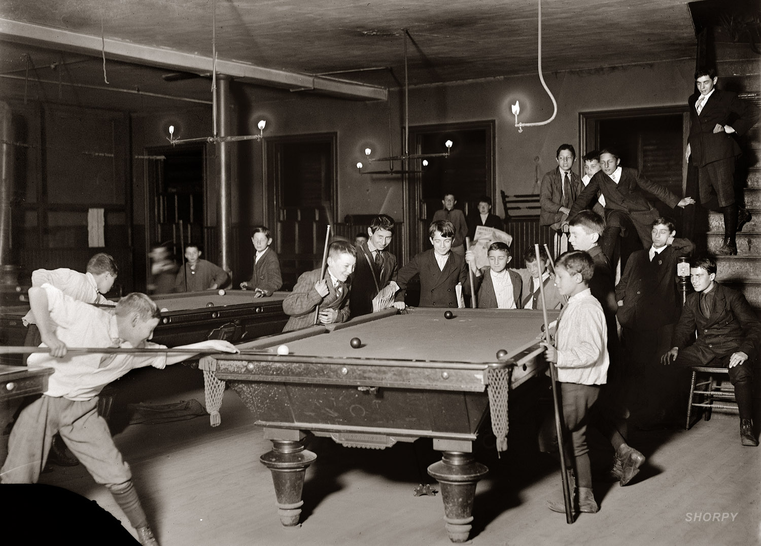 Newsboy Club in Boston. October 1909. Photo by Lewis Hine. View full size.