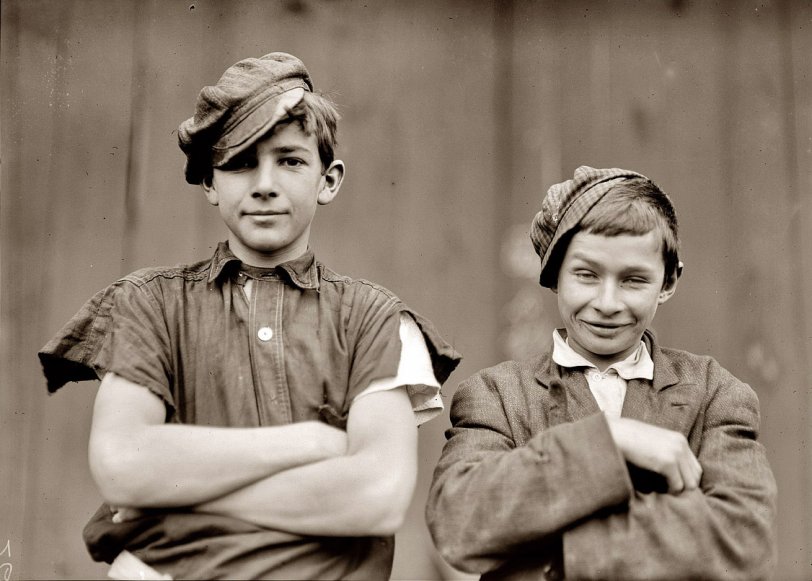 November 1909. Two of the boys on night shift in the More-Jones Glass Co., Bridgeton, New Jersey. View full size. Photograph by Lewis Wickes Hine.