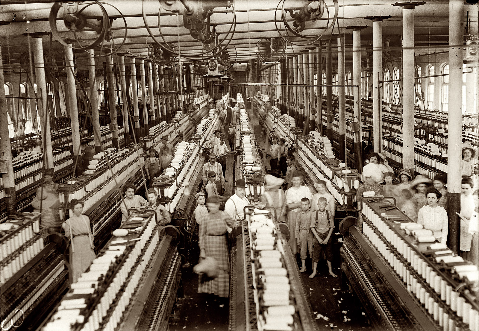 March 1911. Magnolia, Mississippi. "Magnolia Cotton Mills spinning room. See the little ones scattered through the mill. All work." View full size. Photograph (original glass negative) and caption by Lewis Wickes Hine.