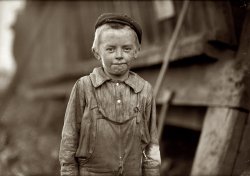 November 1910. "Birmingham, Alabama. 'Our baby doffer,' they called him. Donnie Cole. Has been doffing for some months. When asked his age, he hesitated, then said, 'I'm twelve.' Another young boy said, 'He can't work unless he's twelve'."  Photo and caption by Lewis Wickes Hine for the National Child Labor Committee. View full size.