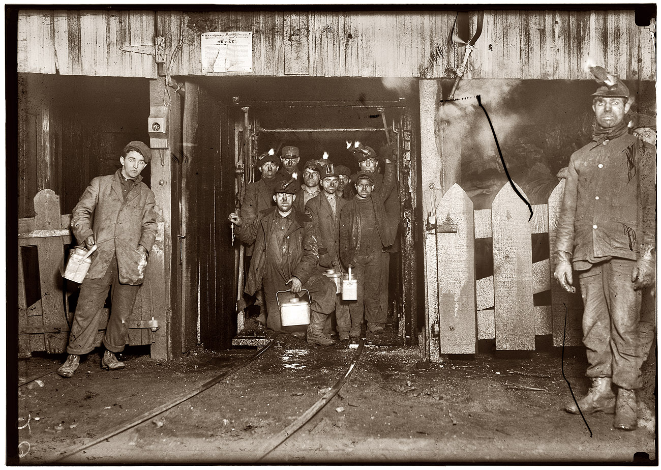 January 1911. Shaft #6, Pennsylvania Coal Co. mine at South Pittston. "At the close of the day. Waiting for the cage to go up. Small boy in front is Joe Pume, a Nipper, 163 Pine St." View full size. Photo and caption by Lewis Wickes Hine.