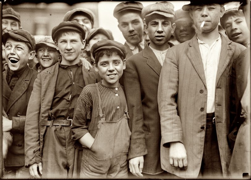September 1911. Lawrence, Massachusetts. "Group of workers. The small boy in the middle is Secondino Libro, 34 Walnut Street. Apparently 10 or 11. Works in No. 4 Spinning room." View full size. Photo and caption by Lewis Wickes Hine.