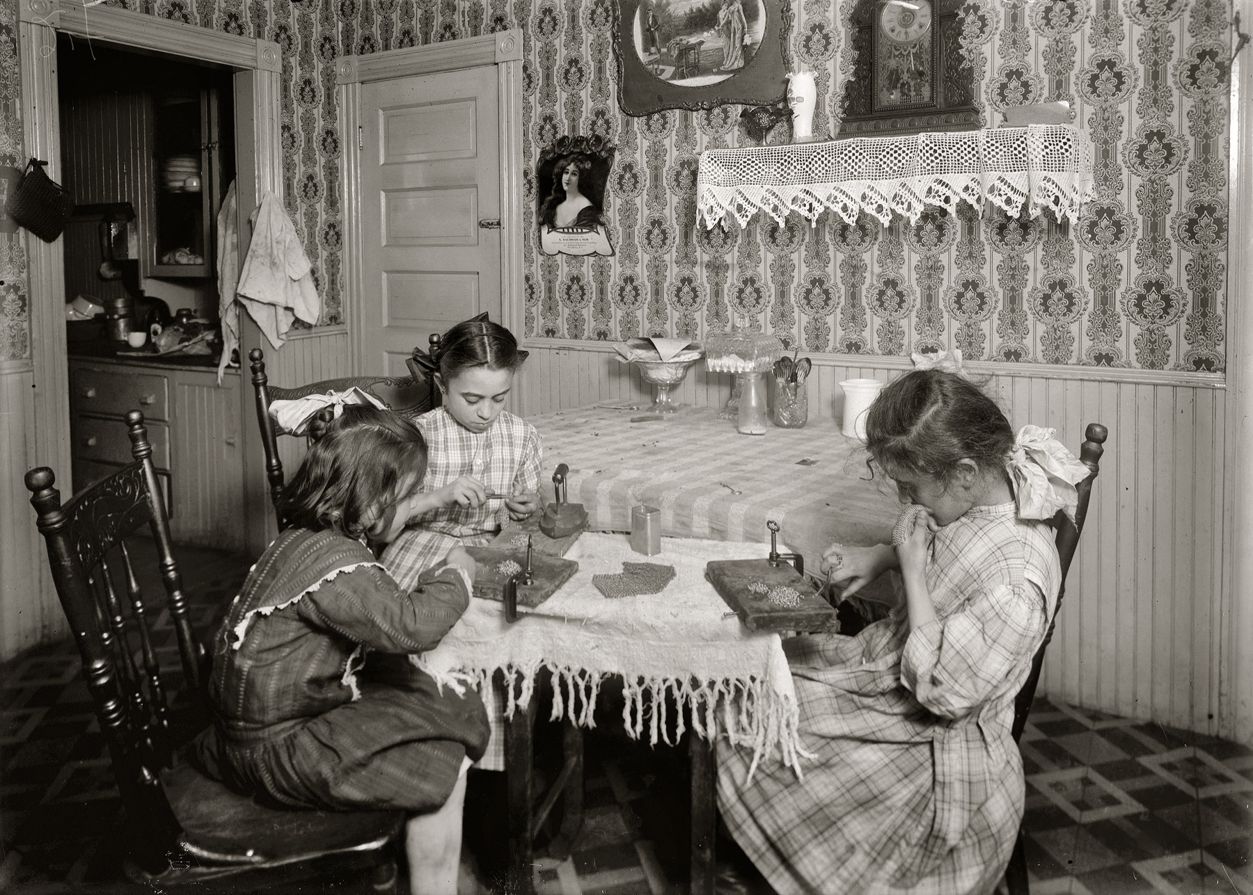 November 1912. Providence, Rhode Island. "Girls 6, 9 and 11 years old, working on chain-bags in home of Mrs. Antonio Caruso, 132 Knight Street." Imaged from a glass negative taken by Lewis Wickes Hine. View full size.