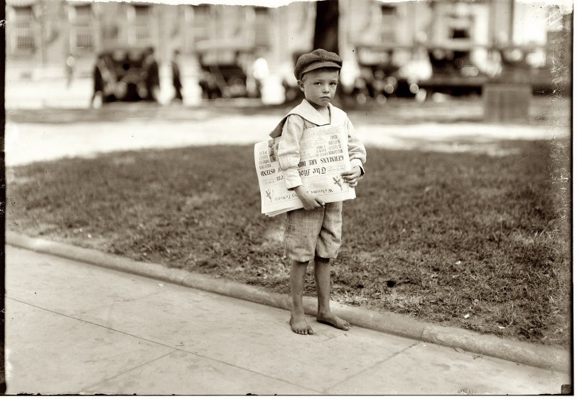 October 1914. Mobile, Alabama. "Seven-year-old Ferris. Tiny newsie who did not know enough to make change for the investigator. There are still too many of these little ones in the larger cities." View full size. Photo by Lewis Wickes Hine.
