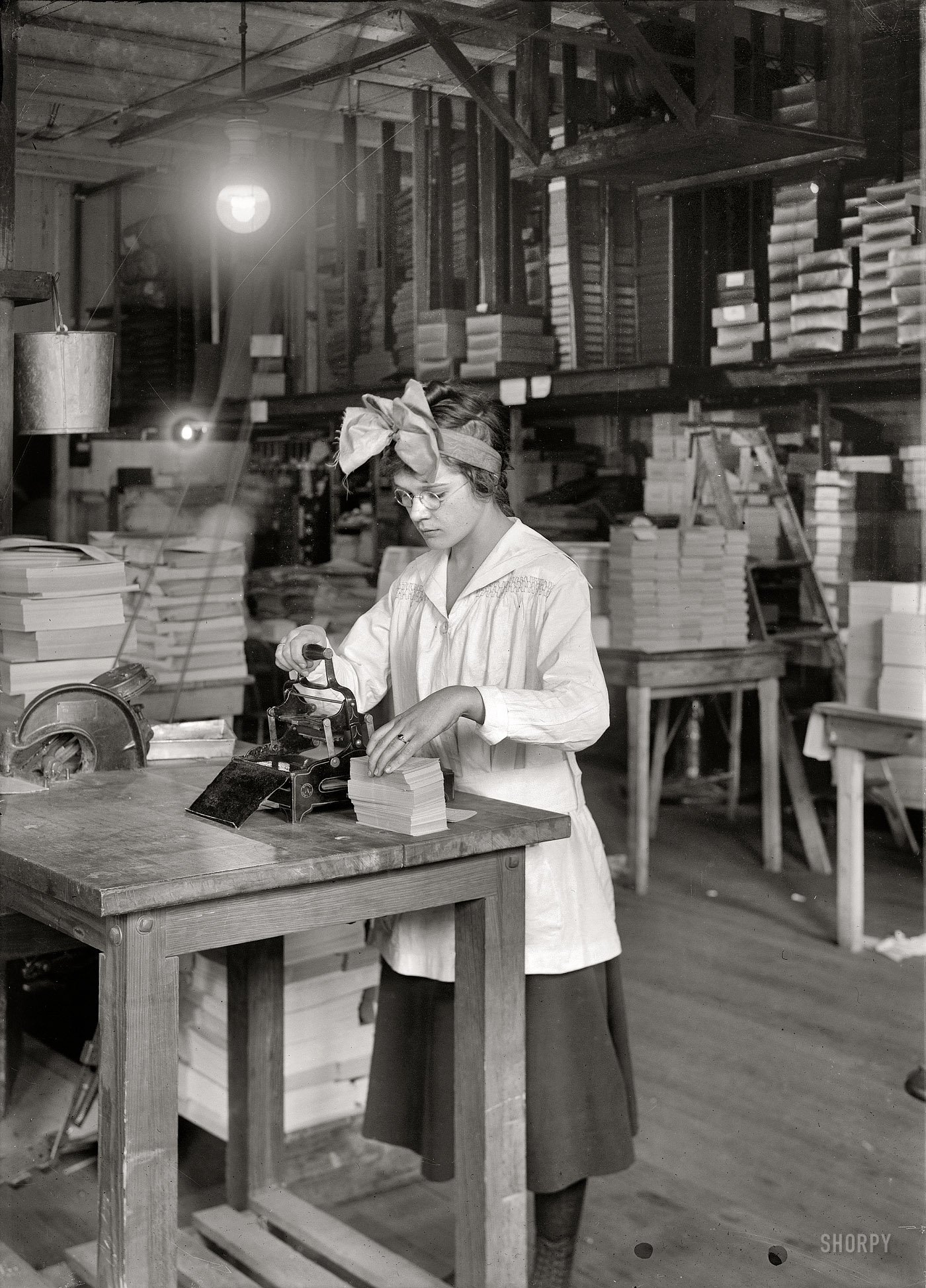 January 31, 1917. "Stamping labels. Boston Index Card Co., 113 Purchase Street." Photograph and caption by Lewis Wickes Hine. View full size.