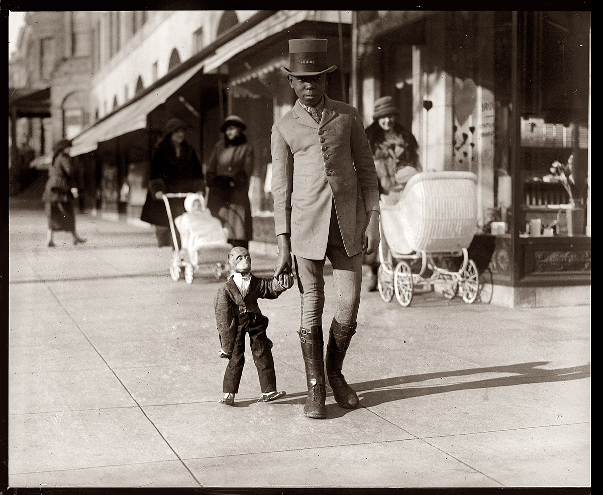 "Louise and flower-shop monkey" on a Washington, D.C., sidewalk. February 8, 1922. View full size. National Photo Company Collection.