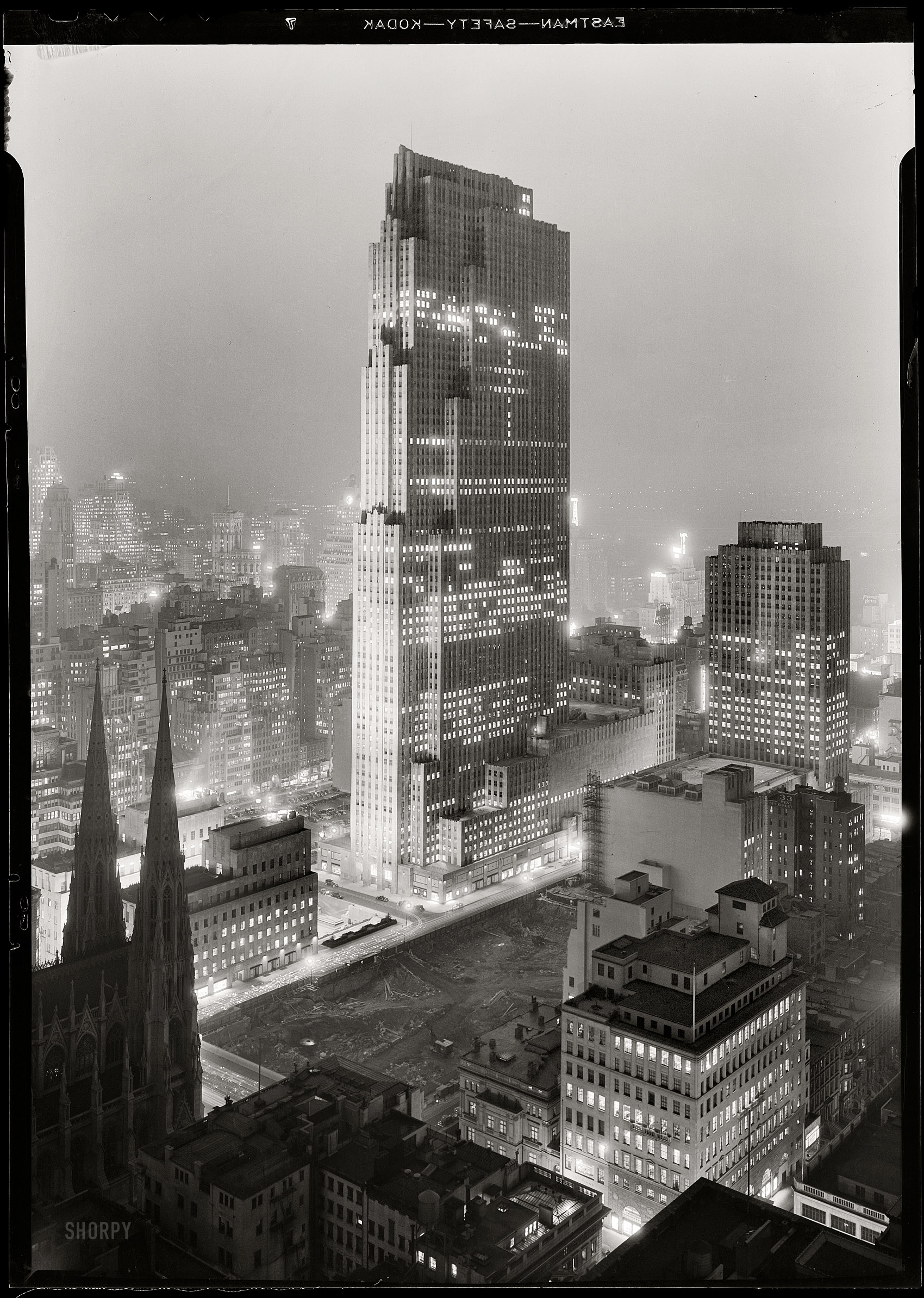New York. December 5, 1933. "Rockefeller Center and RCA Building from 515 Madison Avenue." Digital image recovered from released emulsion layer of the original 5x7 acetate negative. Gottscho-Schleisner photo. View full size.